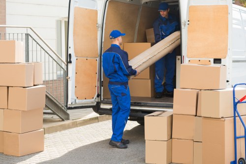 Local removals team working in Aperfield with house move boxes