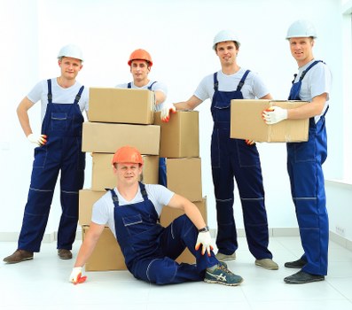 Local removals crew unloading household items at a new Aperfield home