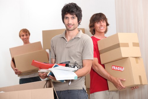 Business move checklist and labelled boxes prepared for office removals