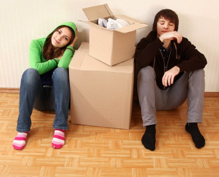 Moving team planning a home move in Aperfield with boxes and furniture