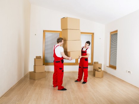 Removal team loading boxes for a house move in Aperfield